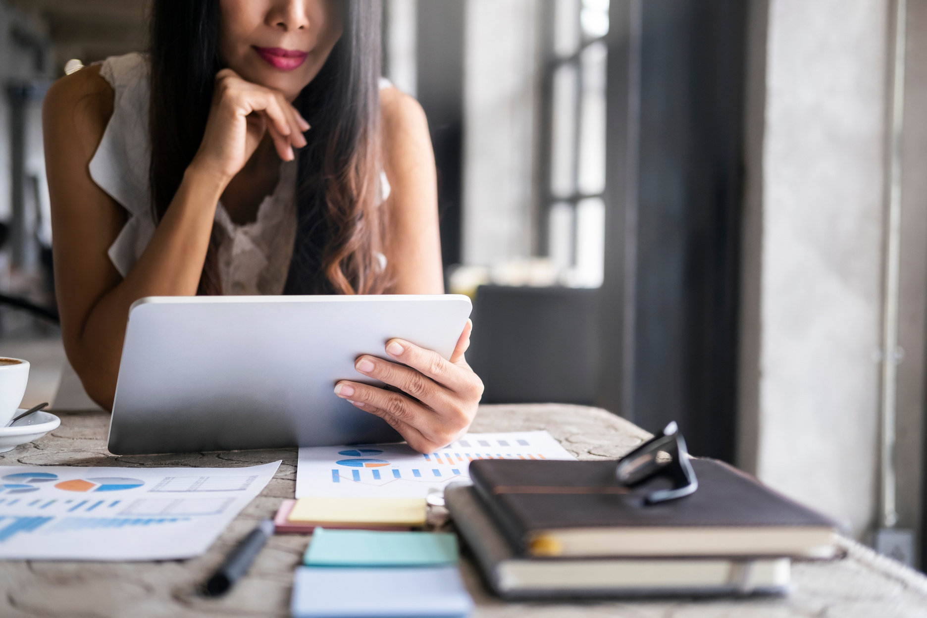 Businesswoman Analyzing Investment Documents