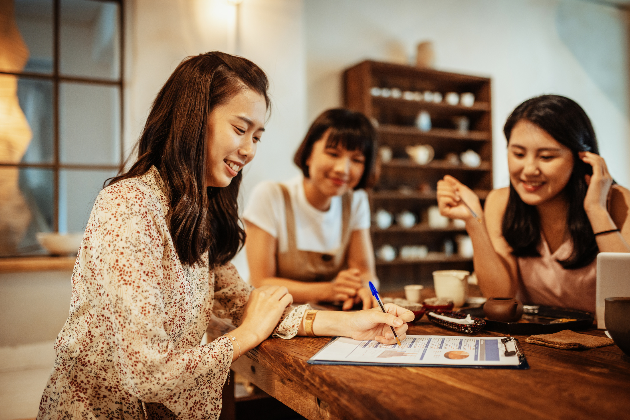 Taiwanese women talking about new investment project